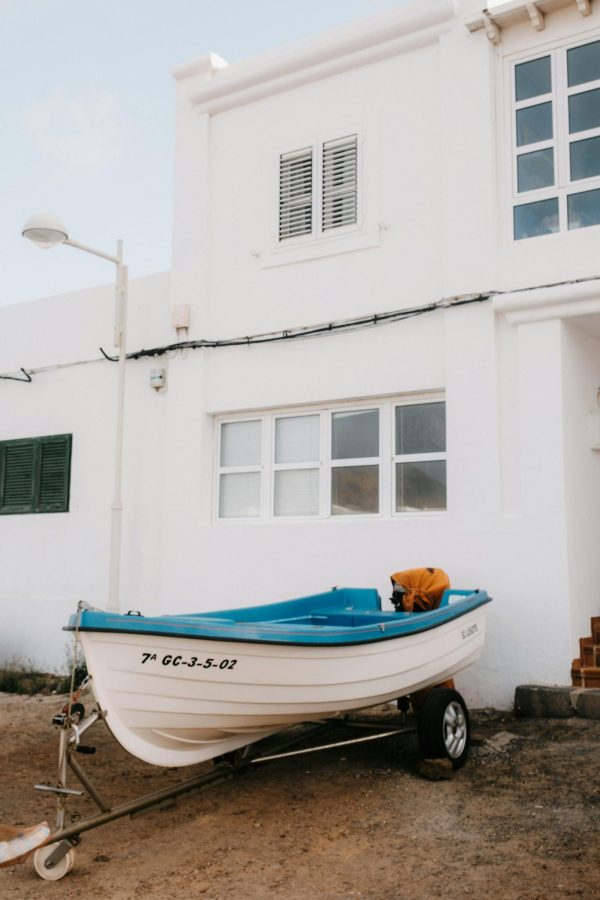 Small Boat by White Coastal House